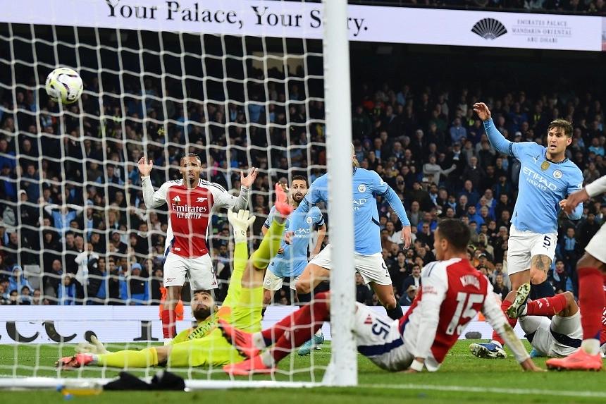 Late Stones goal secures draw for Man City against Arsenal